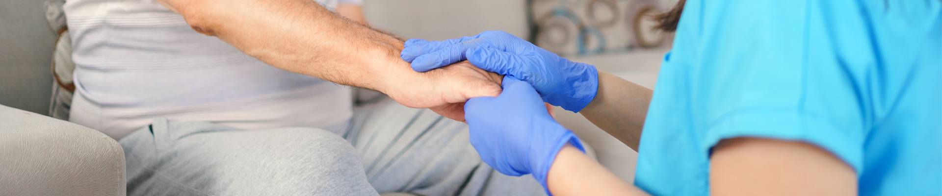 nurse holding patients hands