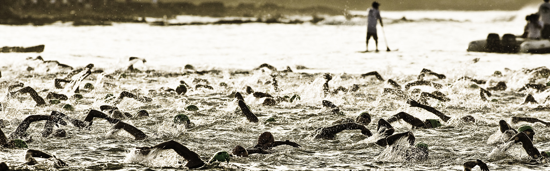 Large group of people swimming in a lake